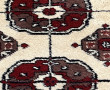 Tapis en laine dans les tons beige et ro