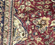 Tapis en laine dans les tons rouges, ble