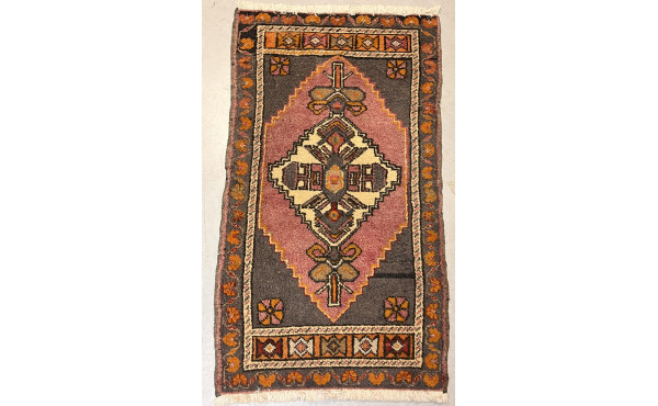 Petit tapis en laine points noués dans l
