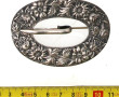 Boucle broche en argent à décor floral, 