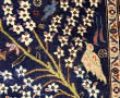 Tapis en laine points noués à décor de c