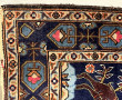 Tapis en laine points noués à décor de c