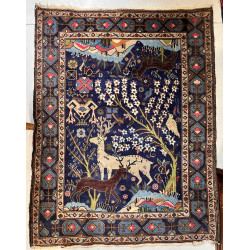 Tapis en laine points noués à décor de c