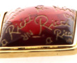 NINA RICCI - Broche en métal doré et rés