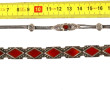 Deux bracelets en argent dont l'un portr