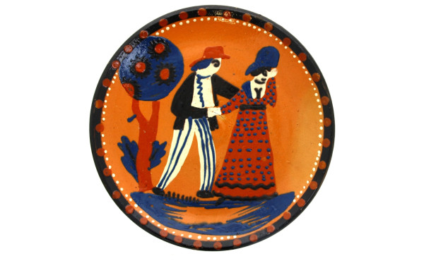 Plat rond en céramique à décor d'un coup