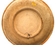 Plat rond en céramique à décor d'un coup