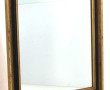 Miroir encadrement doré et réhauts noir