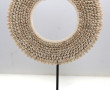 Collier pectoral en cauris dans l'espri