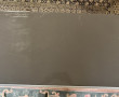Console moderne laquée gris ouvrant à 2 