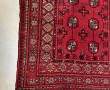 Tapis en laine points noués à décor géom