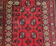 Tapis en laine points noués à décor géom