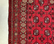 Tapis en laine points noués à décor géom