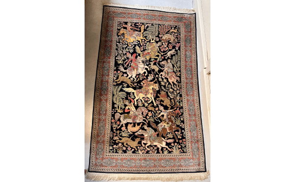Tapis en laine et soie à décor d'une scè