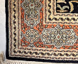 Tapis en laine et soie à décor d'une scè