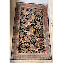 Tapis en laine et soie à décor d'une scè