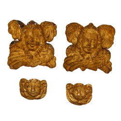 Deux paires de têtes d'anges en bois scu