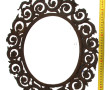 Miroir ancien de forme ovale en métal à 