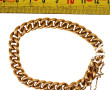 Bracelet gourmette en or jaune 18 cts, c