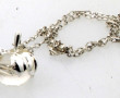 NINA RICCI - Pendentif pomme en métal co