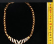 SWAROVSKI - Collier en métal doré et str