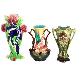 Trois vases en barbotine à décor floral,