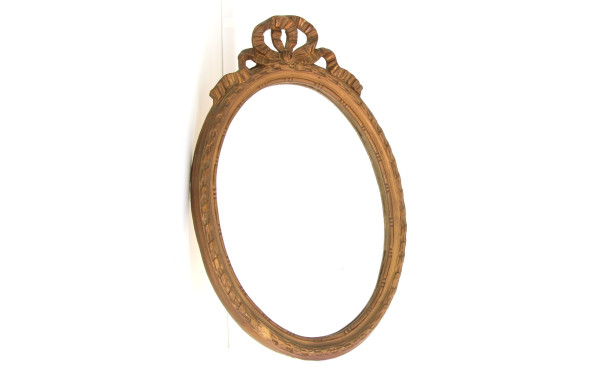 Miroir ovale à décor de nœud de ruban, H