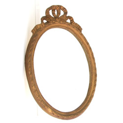 Miroir ovale à décor de nœud de ruban, H