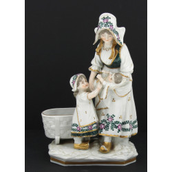 Groupe en porcelaine blanche et or à déc