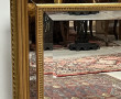 Miroir moderne doré à parecloses