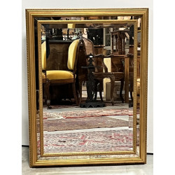 Miroir moderne doré à parecloses