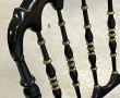 4 chaises en bois noirci et doré assises