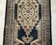 Petit tapis pakistanais en laine à domin