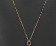Pendentif croix en métal argenté ajouré,