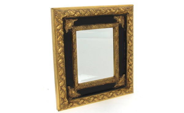 Miroir biseauté dans un encadrement noir