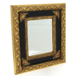 Miroir biseauté dans un encadrement noir