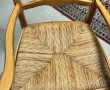 Deux fauteuils en bois fruitier décor co