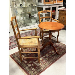 Deux fauteuils en bois fruitier décor co