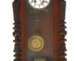 Pendule murale en bois foncé, cadran éma
