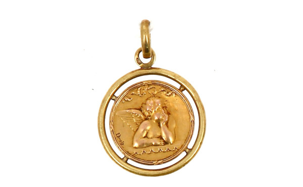 Médaille à décor d'un angelot en or jaun