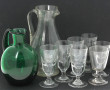 Deux pichets anciens, l'un en verre tran
