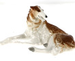 "Lévrier couché", sujet en porcelaine po