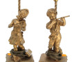 Paire de lampes en métal redoré figurant