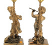Paire de lampes en métal redoré figurant