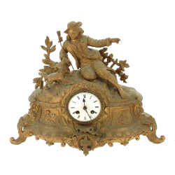 Pendule XIXe en métal doré, vendue en l'
