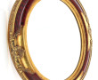 Miroir ovale à encadrement doré style ro