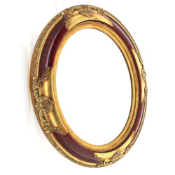 Miroir ovale à encadrement doré style ro