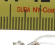 Petit pendentif en or gris 18 cts, serti