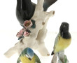 Trois sujets en porcelaine oiseaux et hi