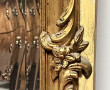 Important trumeau en bois et stuc doré, 